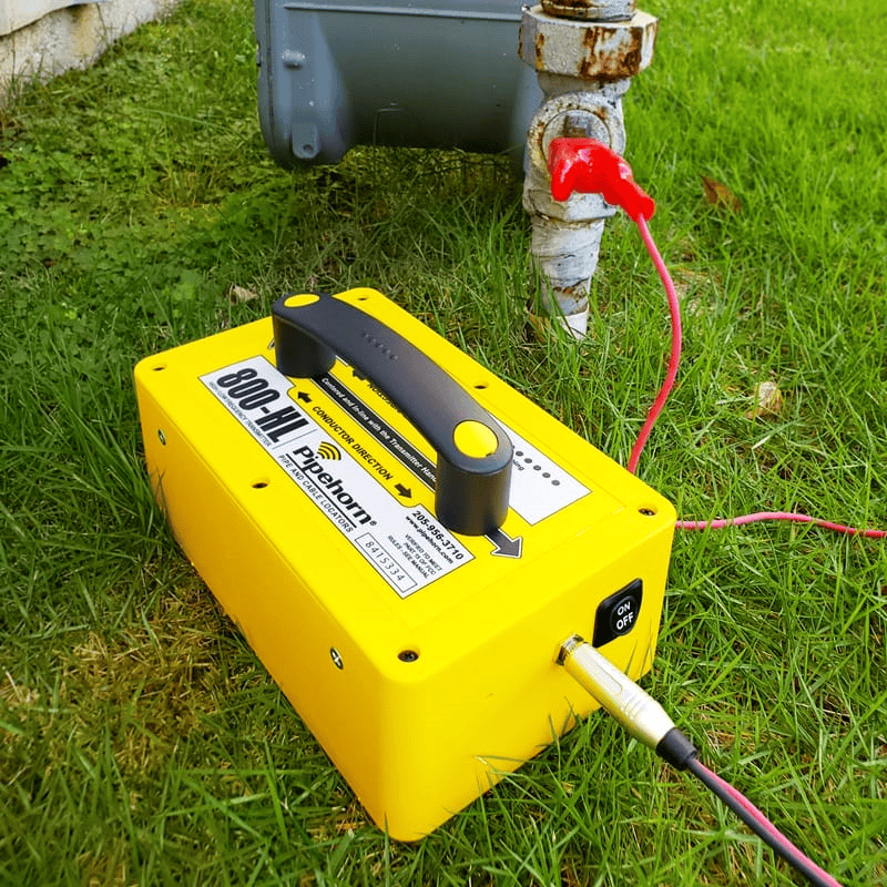 Pipehorn 800-HL Pipe and Cable Locator Transmitter being used conductively